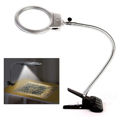 Adjustable magnifying lamp